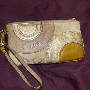 Im selling a beautiful small gold coach cosmetic bag or money bag for dancers!